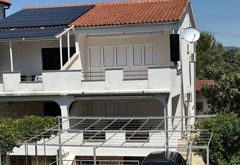 Facade of the house with covered terraces