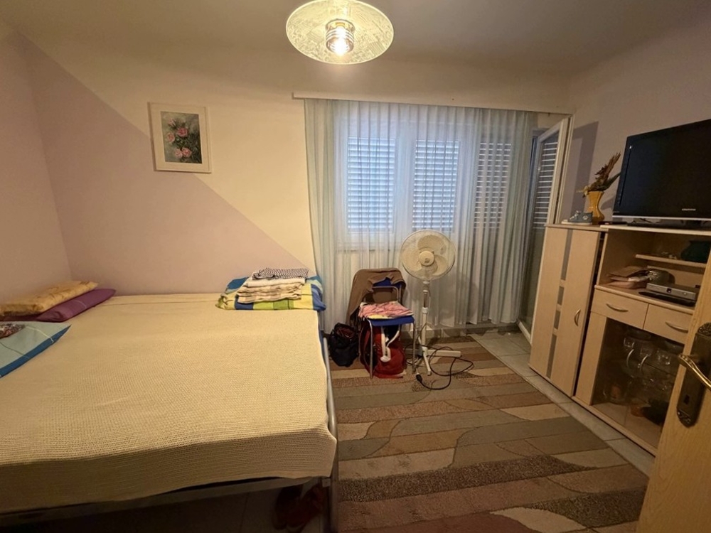 Bedroom with double bed and television