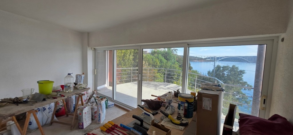 Interior with panoramic window and view of the Krk Bridge