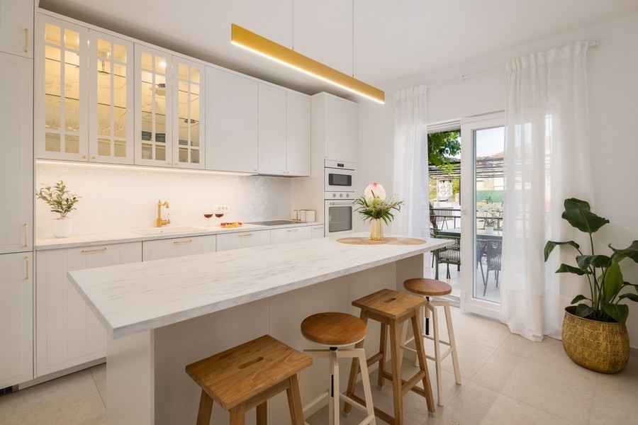 Kitchen with kitchen island and bar stools