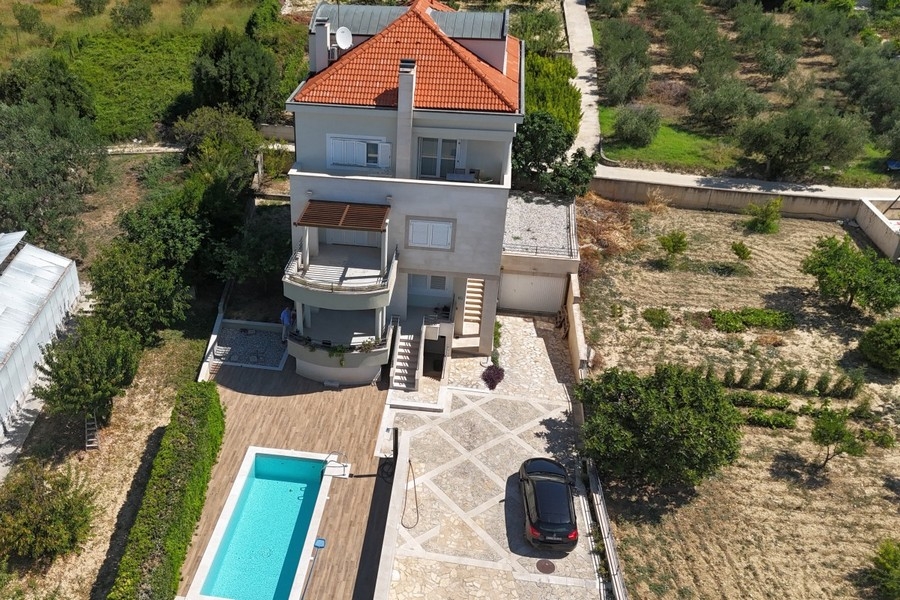 Aerial view of house with swimming pool in Podstrana