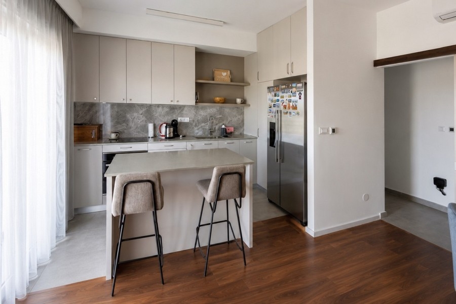 Kitchen with island and bar stools
