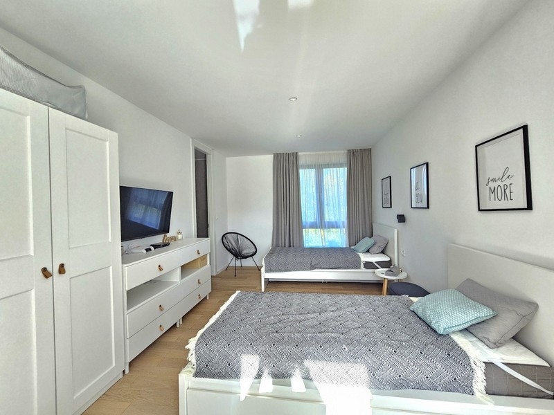 Bright bedroom with two beds