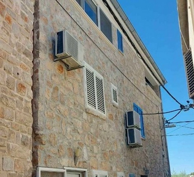 Stone facade of house in Tisno Croatia