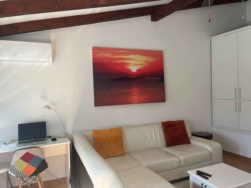 Living area with sofa and cupboard