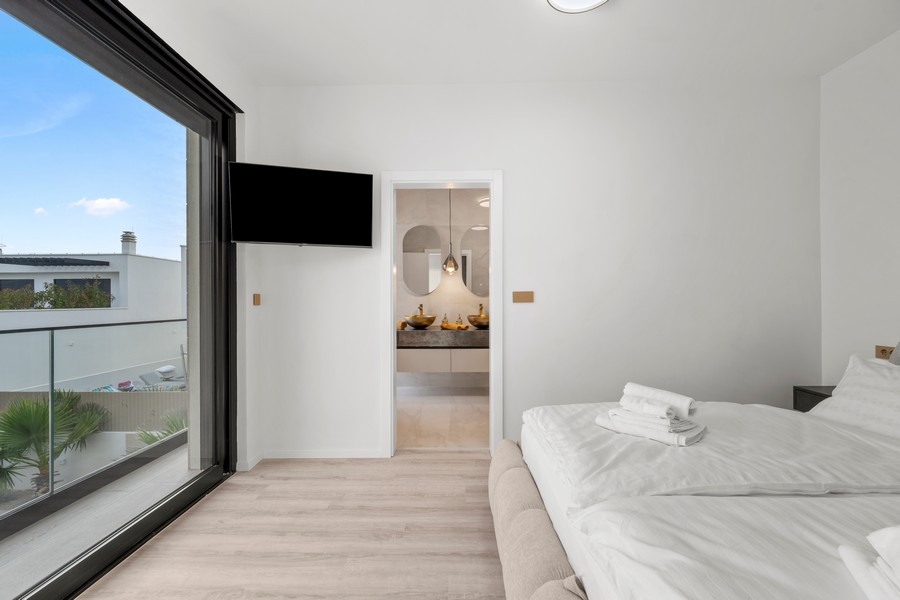 Bedroom with TV and private bathroom