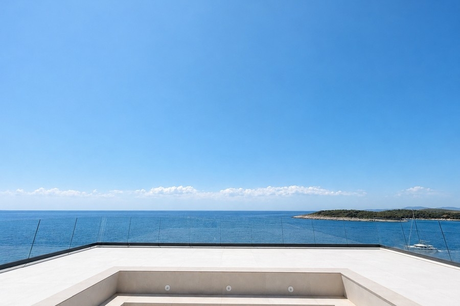 Shallow rooftop pool with sea views