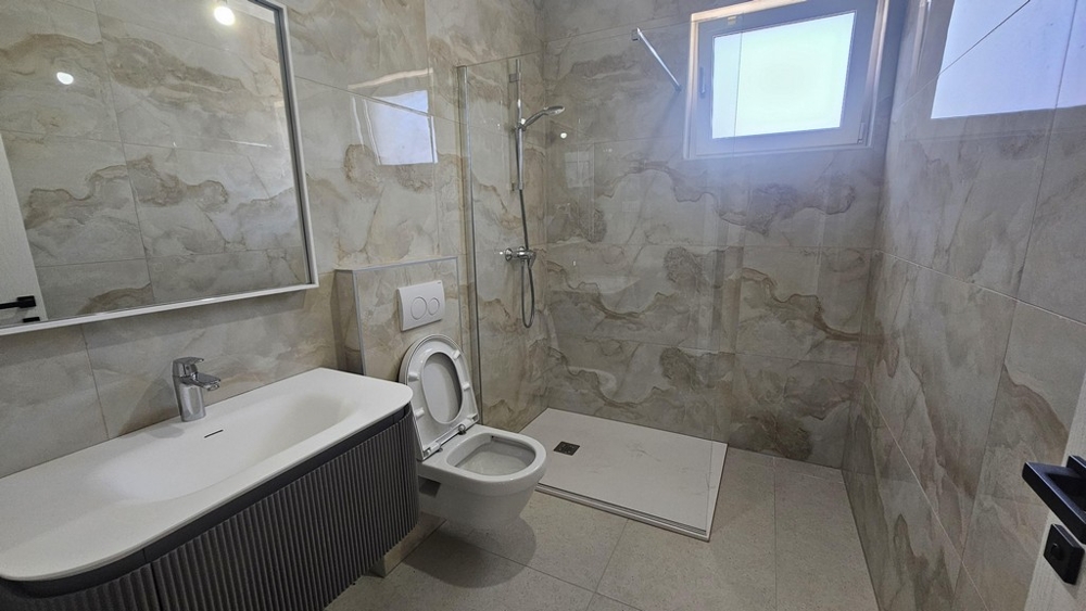 Bathroom with shower and bathtub