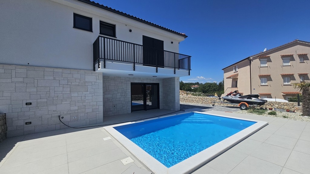 House facade with pool and sun terrace