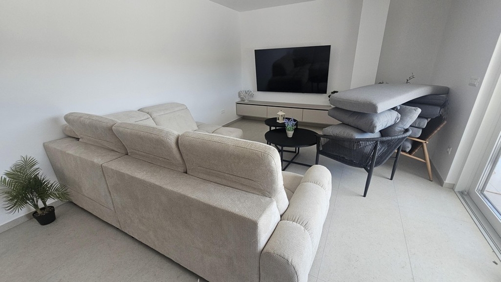 Living area with seating area and television