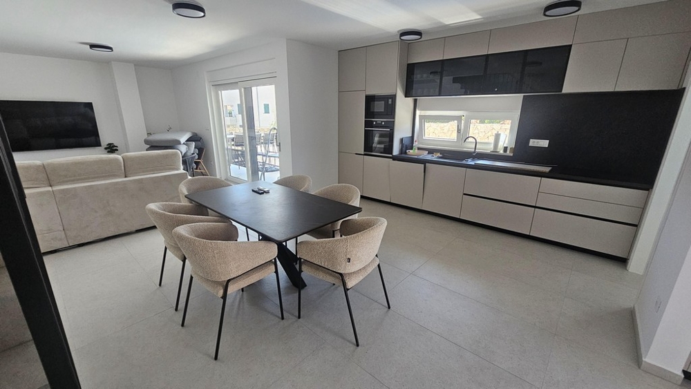 Open living room with dining area and kitchen