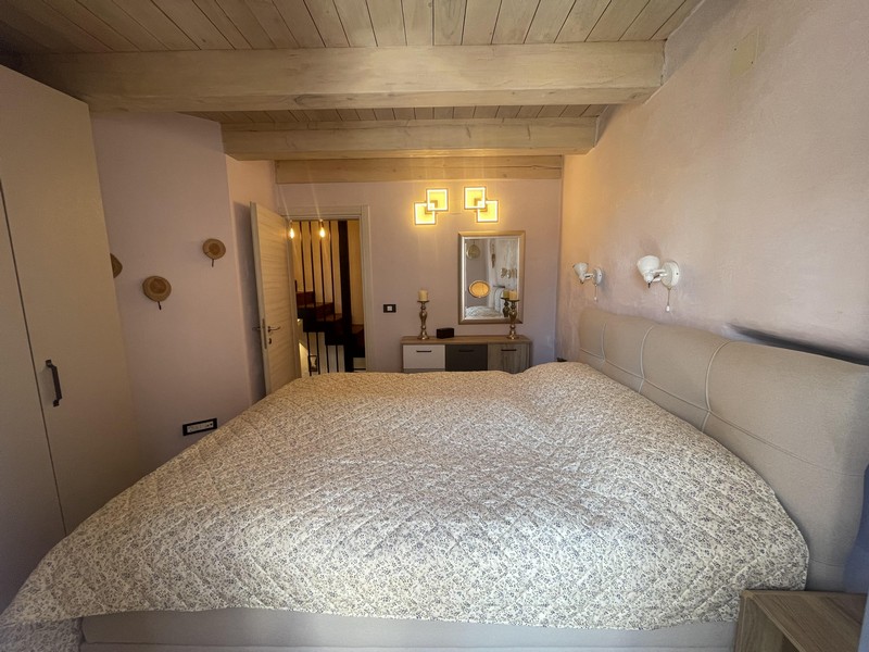 Bedroom with double bed and beamed ceiling