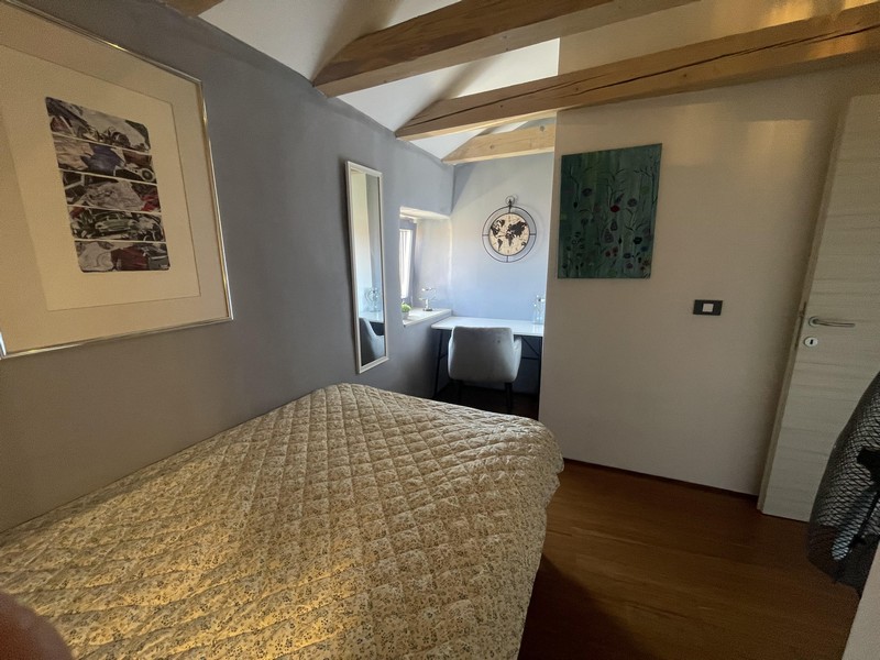 Bedroom with double bed, mural and window