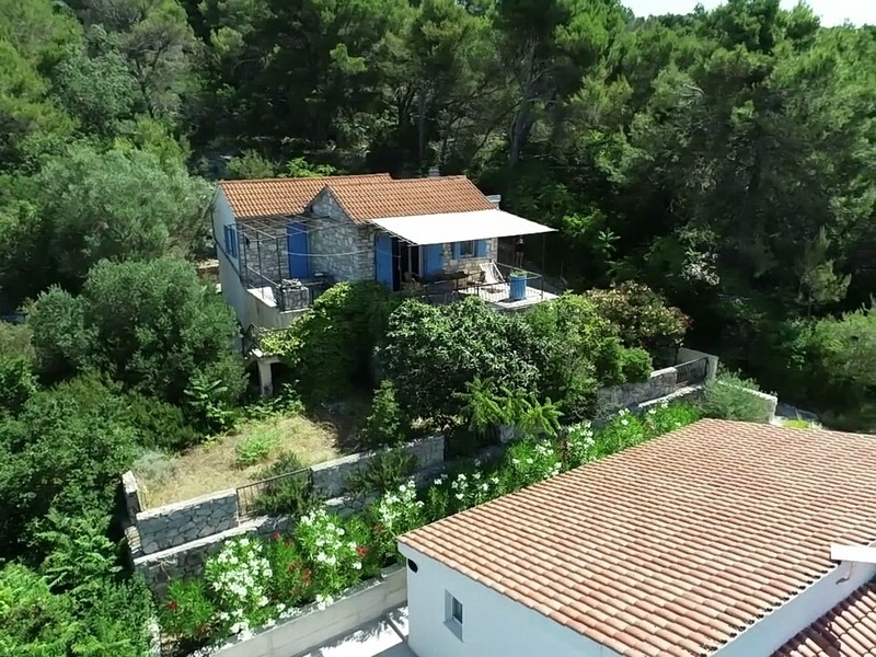 House with blue shutters and covered terrace on Solta
