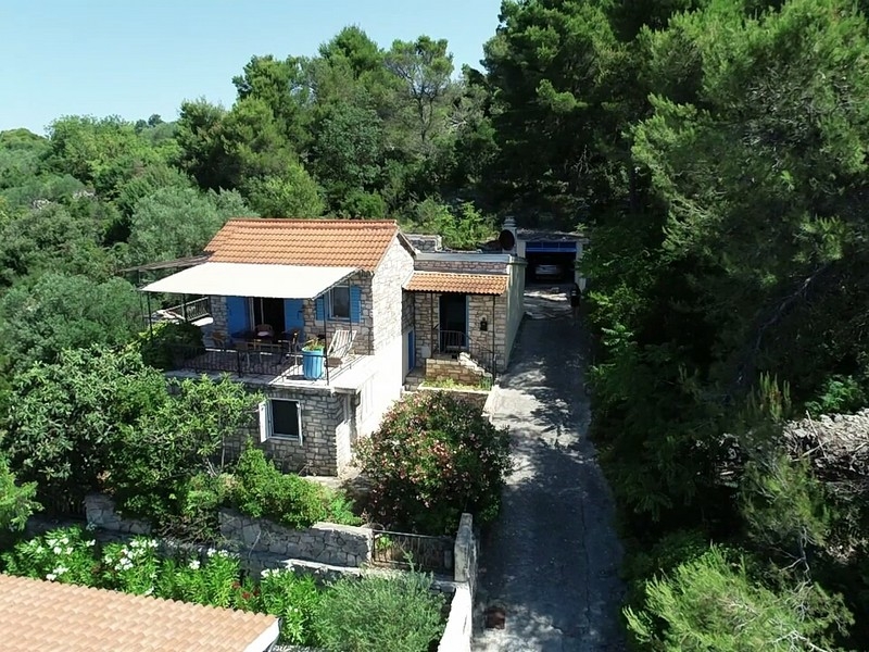 View from above of the stone house with outbuildings on Solta