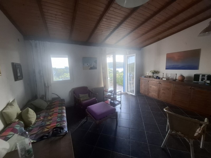 Living room with access to the terrace and views of the sea