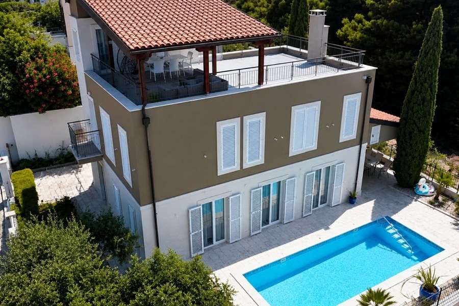 Aerial view of villa with pool and roof terrace on Brac