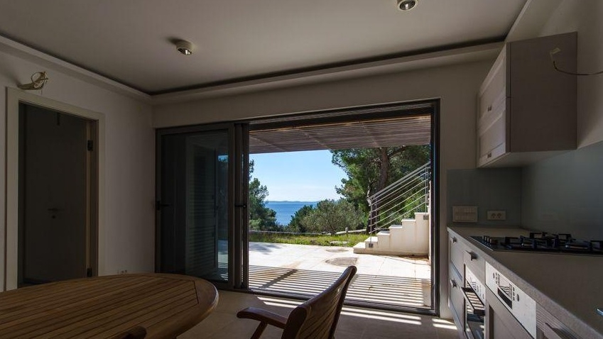 Dining area with a view of the sea through the patio door