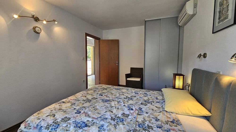 Bedroom with double bed and wardrobe