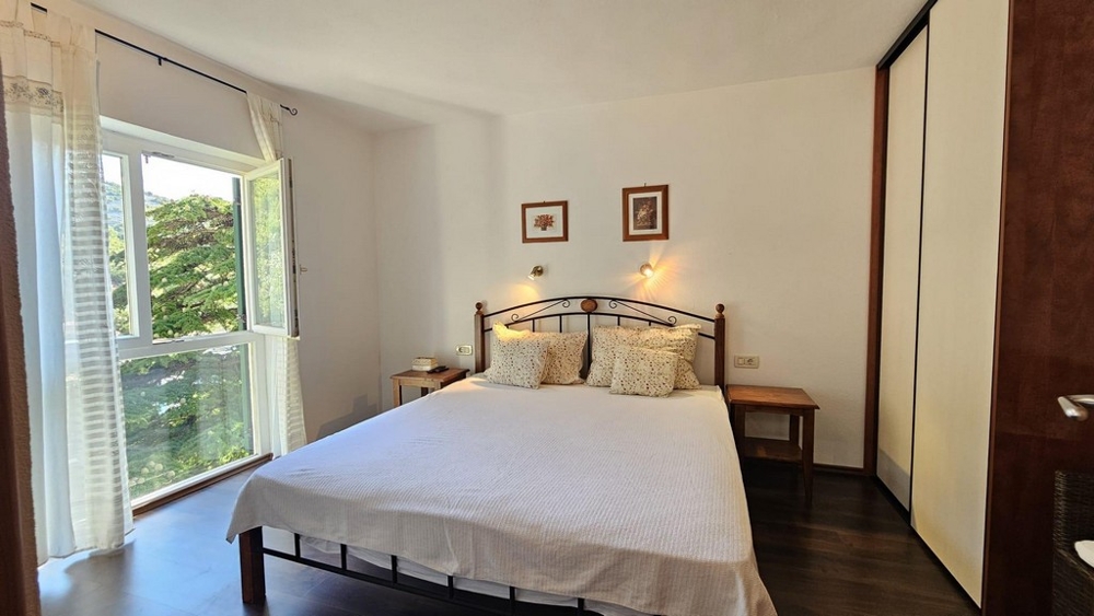 Bright bedroom with bed and window