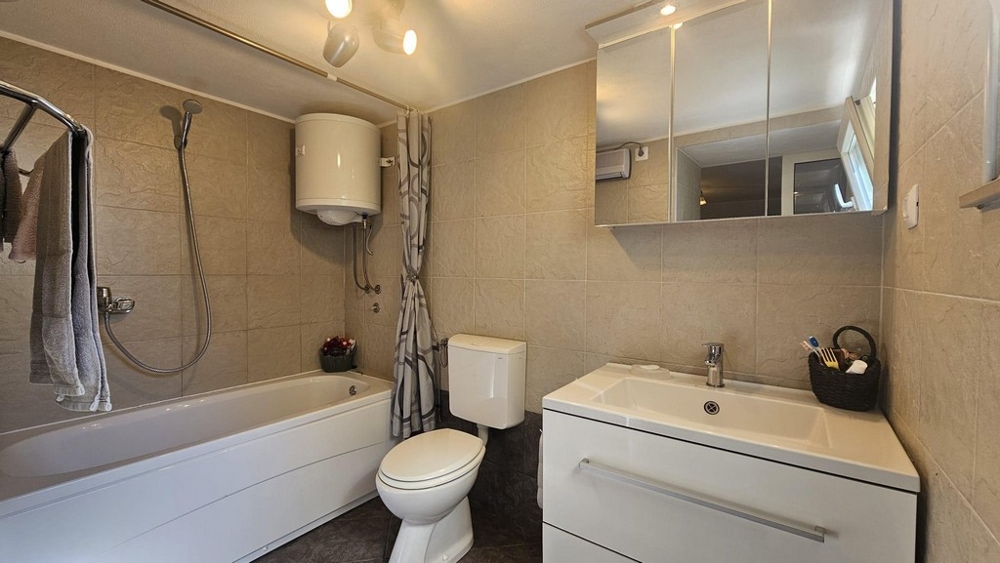 Bathroom with bathtub and sink