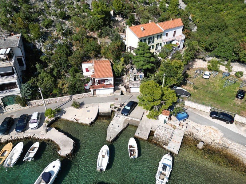 House with garden and boat dock from the air