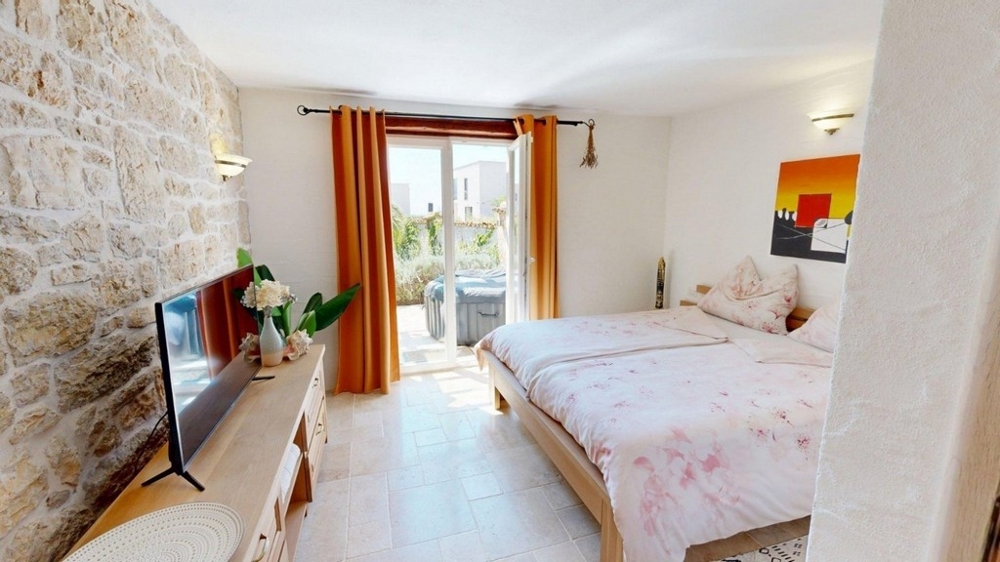 Bedroom with double bed and large window