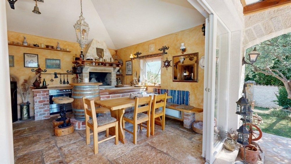 Konoba with fireplace and rustic wooden table