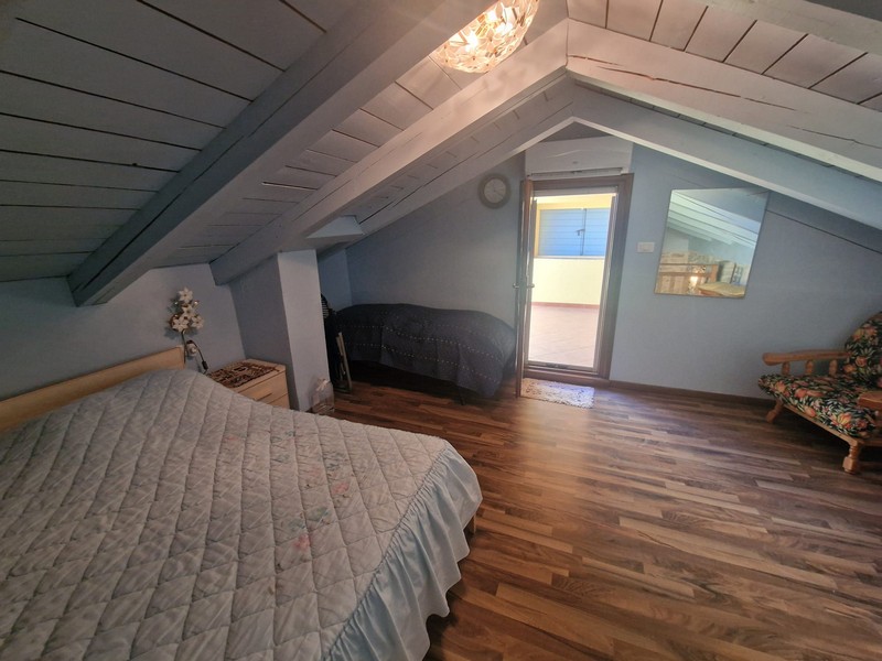 Bedroom under the attic with access to the terrace