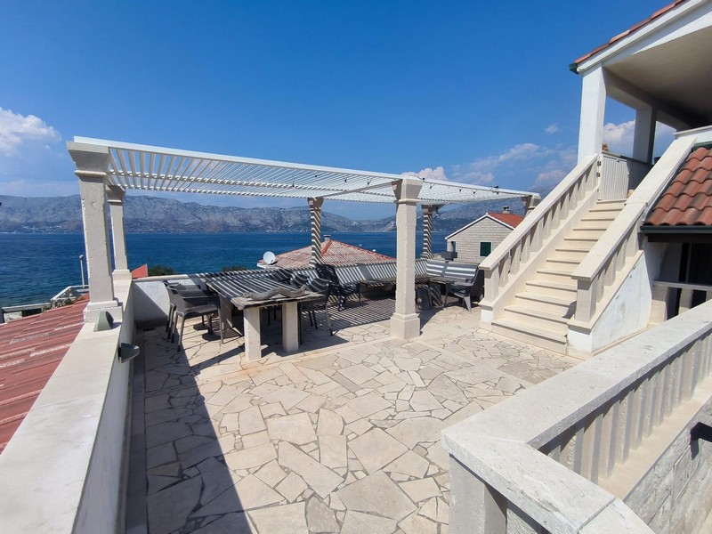 Terrace with sea view of the house with 6 apartments in Povlja on Brac