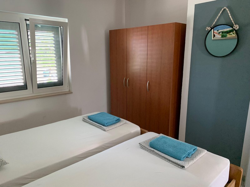 Bedroom in one of the six apartments, house H4090 on Brac Island