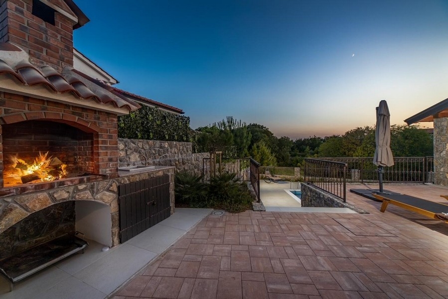 Outdoor fireplace and covered barbecue area