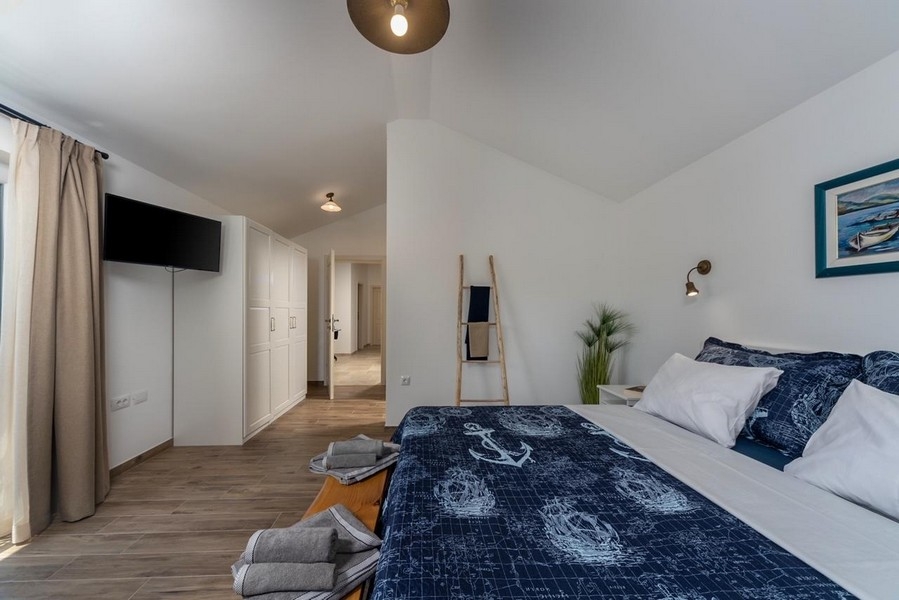 Bedroom with double bed and hallway