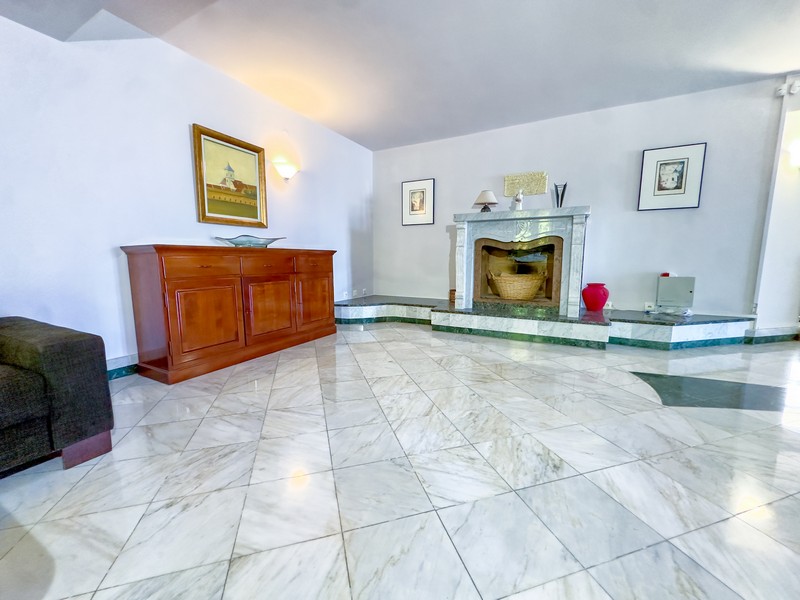 Living room with fireplace in the villa on Krk
