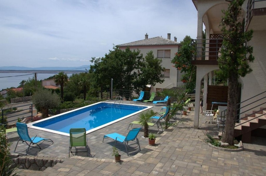 Pool and house facade of the apartment house in Crikvenica
