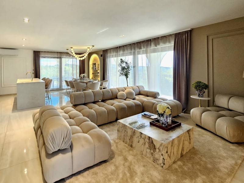 Living room with sofa area and marble floor