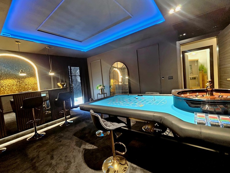 Casino room with roulette table in the basement