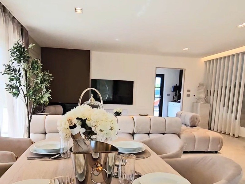 Living room with dining area and sofa area