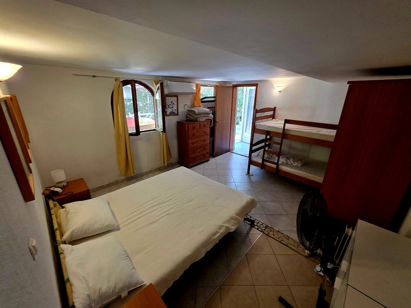 Bedroom with double bed and access to the outside