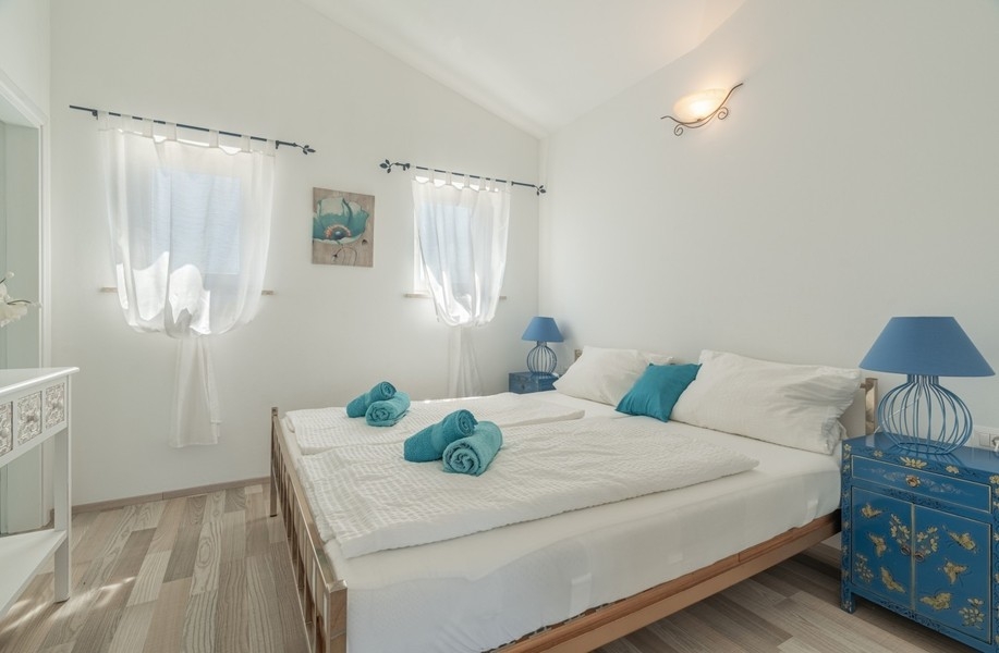 Bedroom with double bed in the villa near Porec