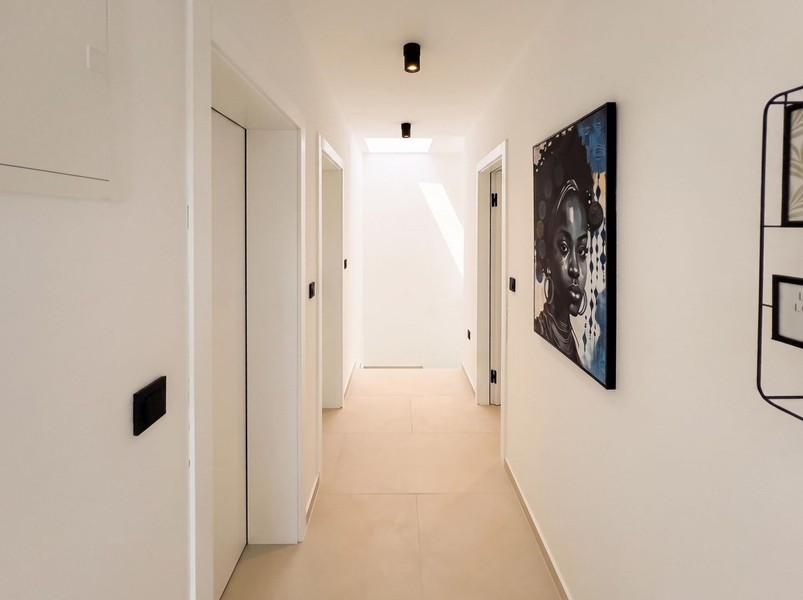 Bright hallway with access to the bedrooms
