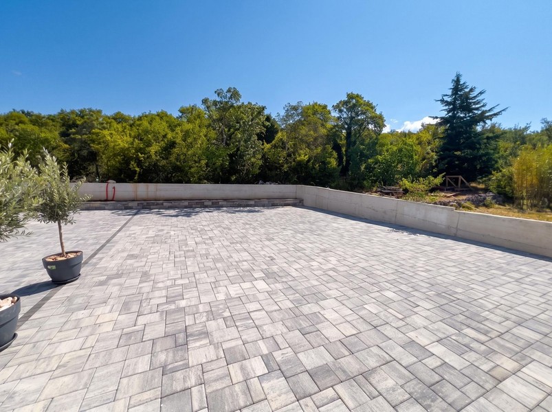 Paved parking space in front of the house