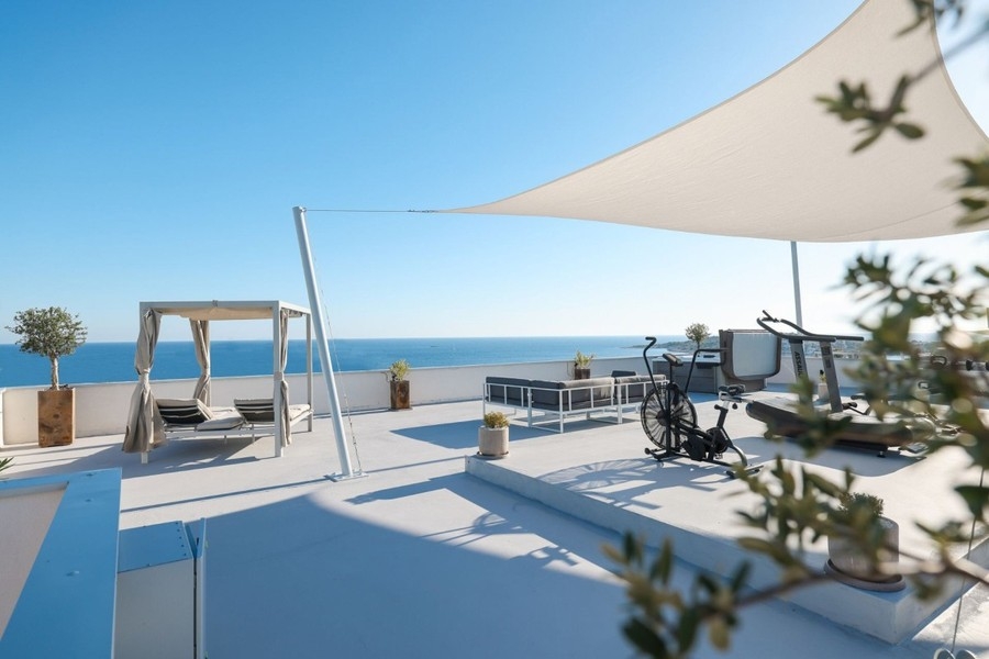 Buy a villa in Croatia - terrace with sun sail near Rogoznica