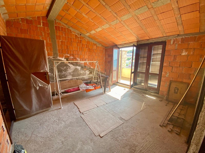Attic in the shell with balcony door