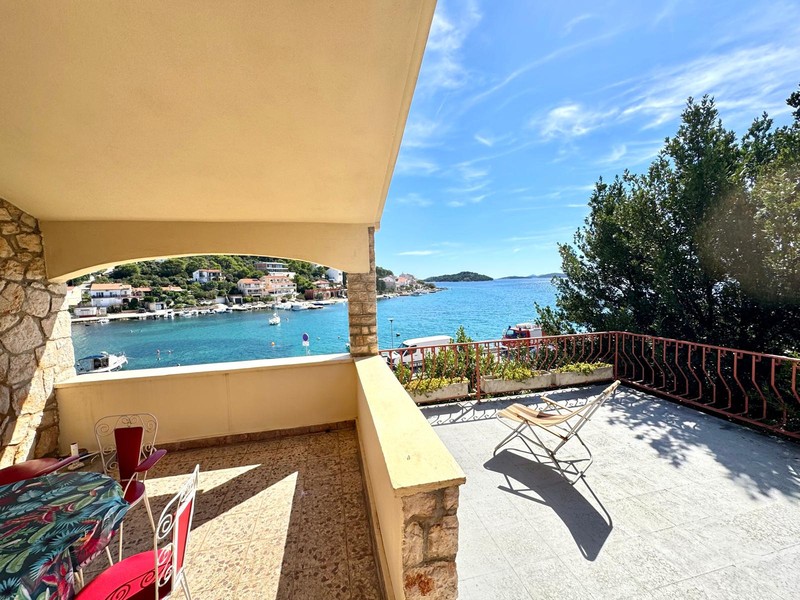 Terrace with seating area and view of the bay