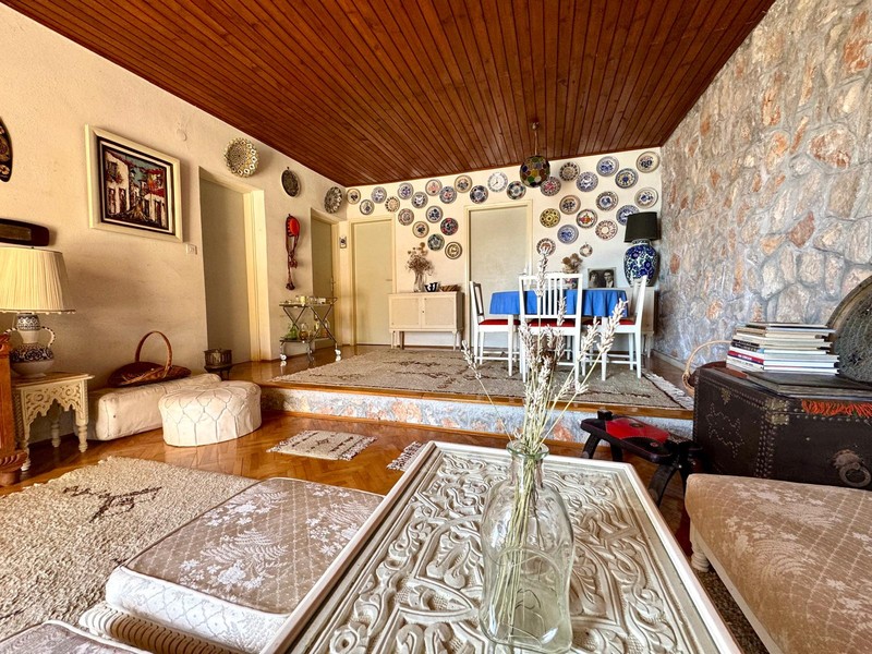 Living area with dining room in the background