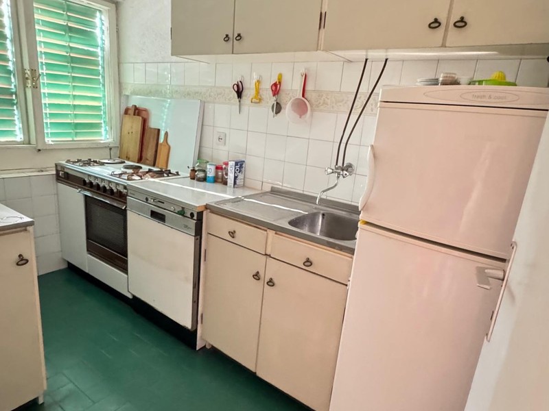 Kitchen with stove and refrigerator