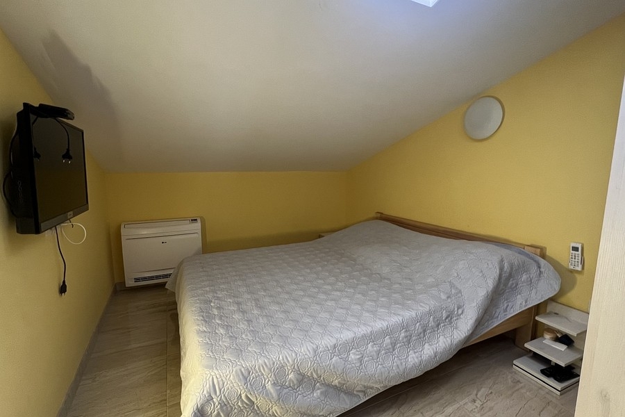 Bedroom with double bed and air conditioning
