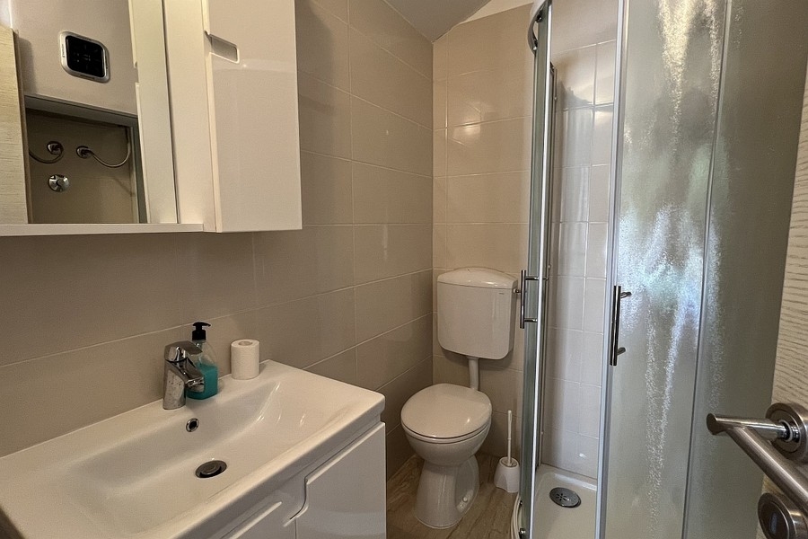 Bathroom with shower and sink