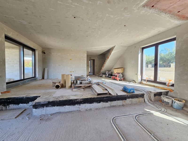Living area in the shell with large glass sliding doors